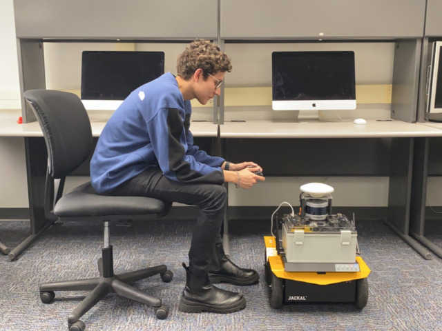 A GulfSCEI researcher controls the Jackal robot.